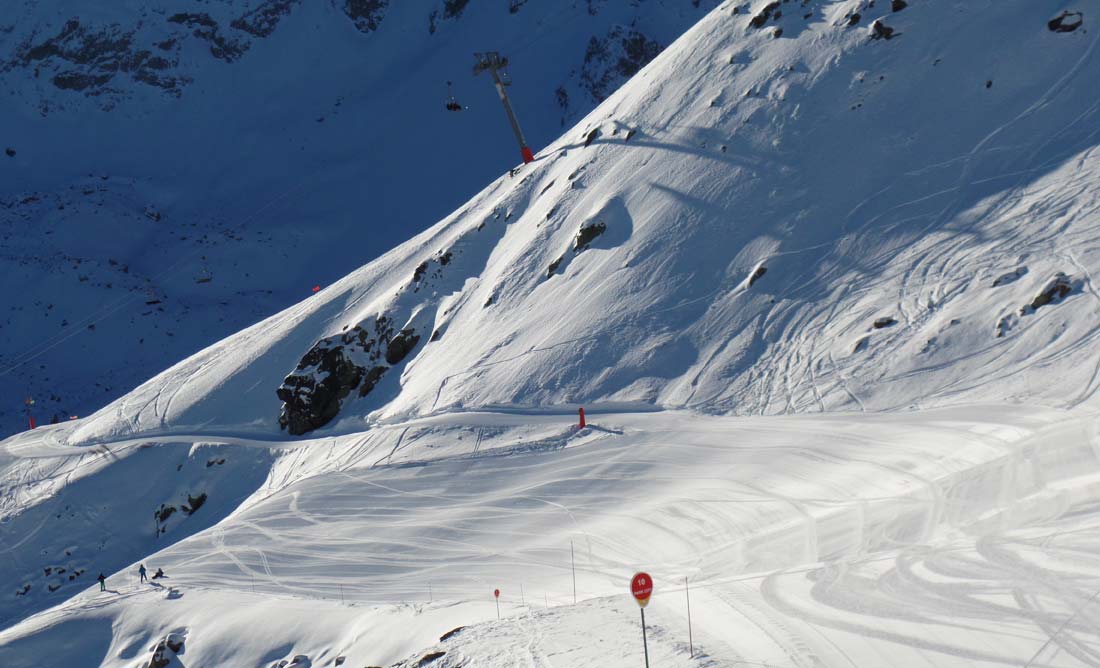 Meribel skiing early morning piste. Sun and great snow.